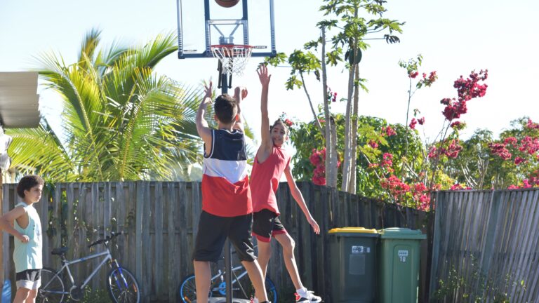 Teens playing basketball